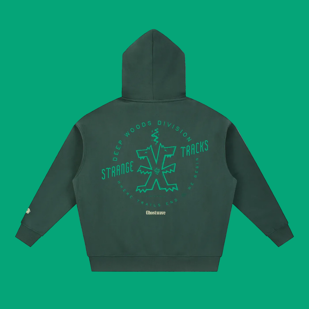 Back of dark green W.I.L.D. Strange Tracks oversized hoodie with green two-headed creature graphic and Ghostwave lettering