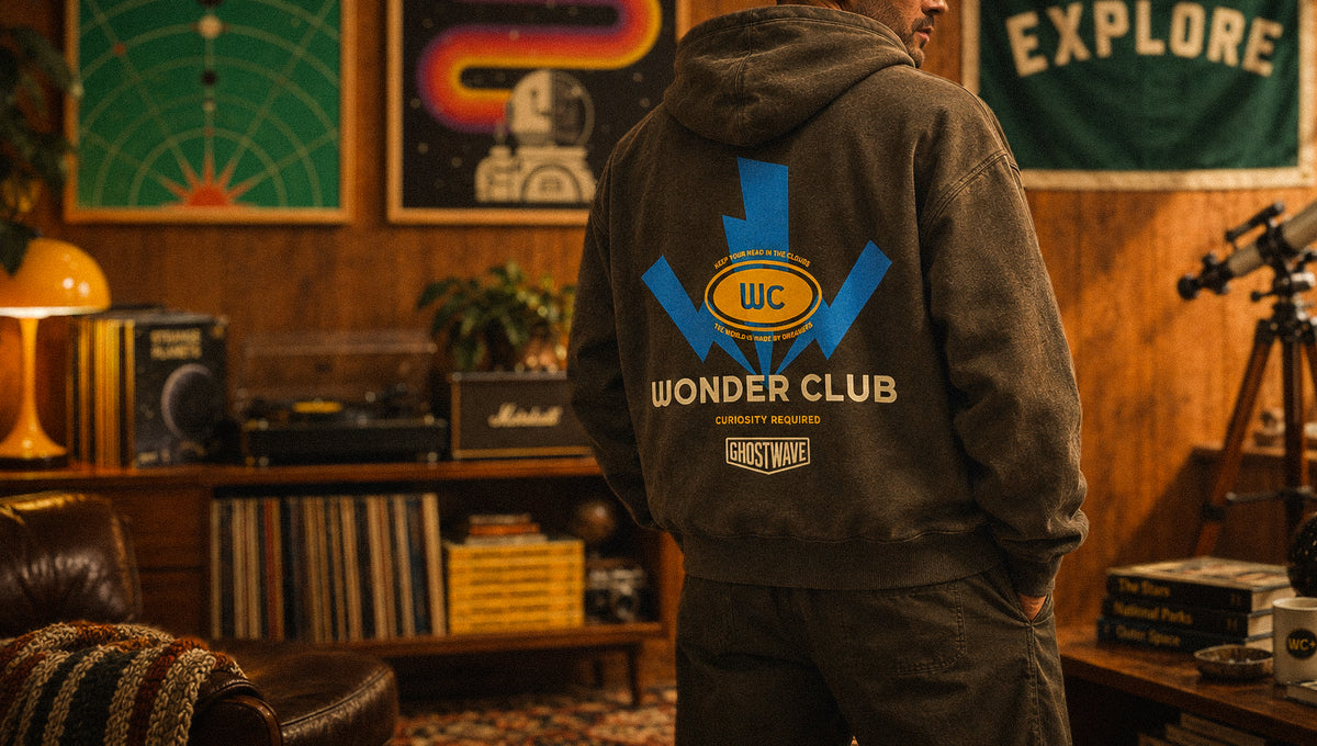 Wonder Club hoodie in a room with Ghostwave art prints, records and a telescope